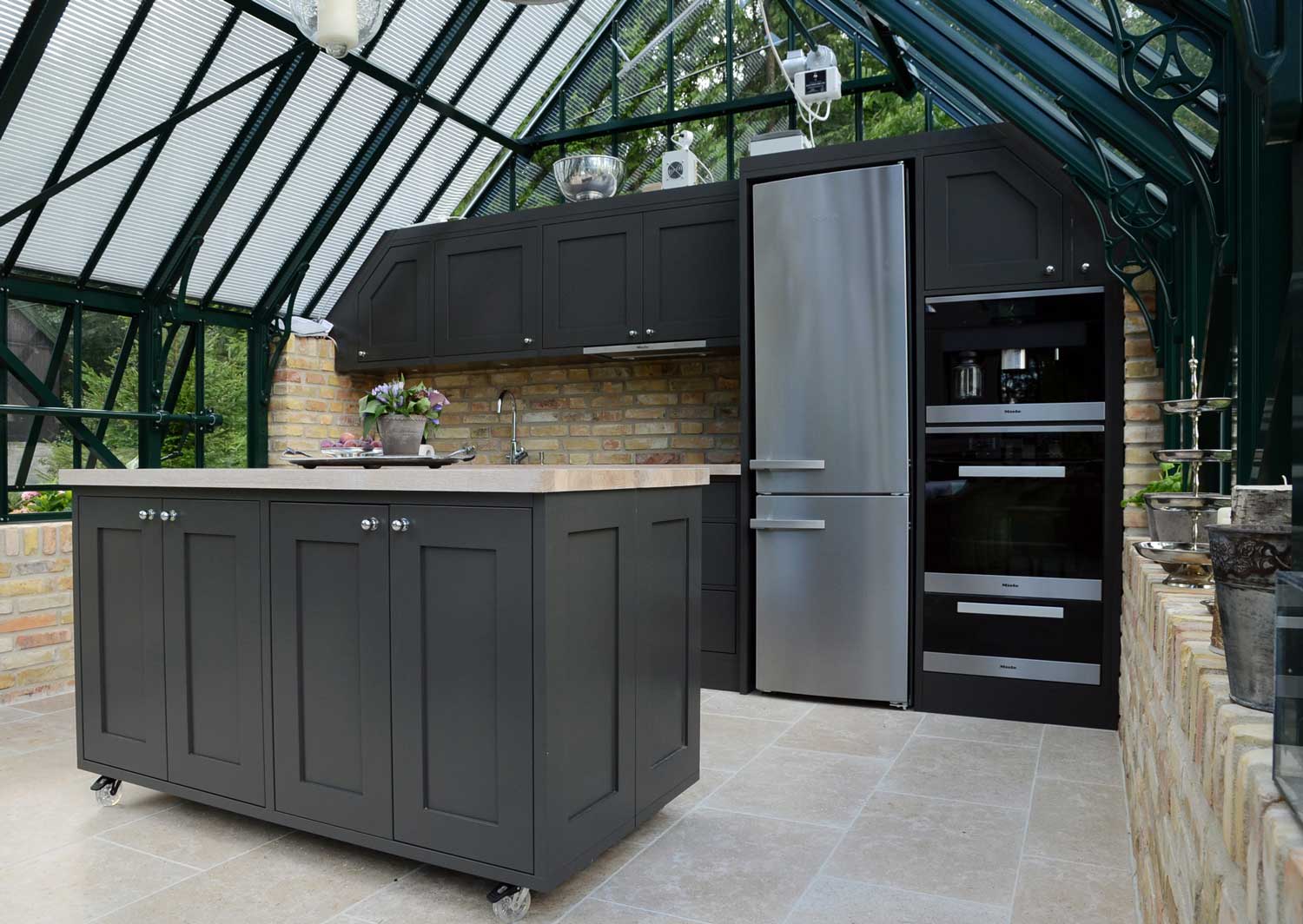 Full size kitchen inside of a greenhouse