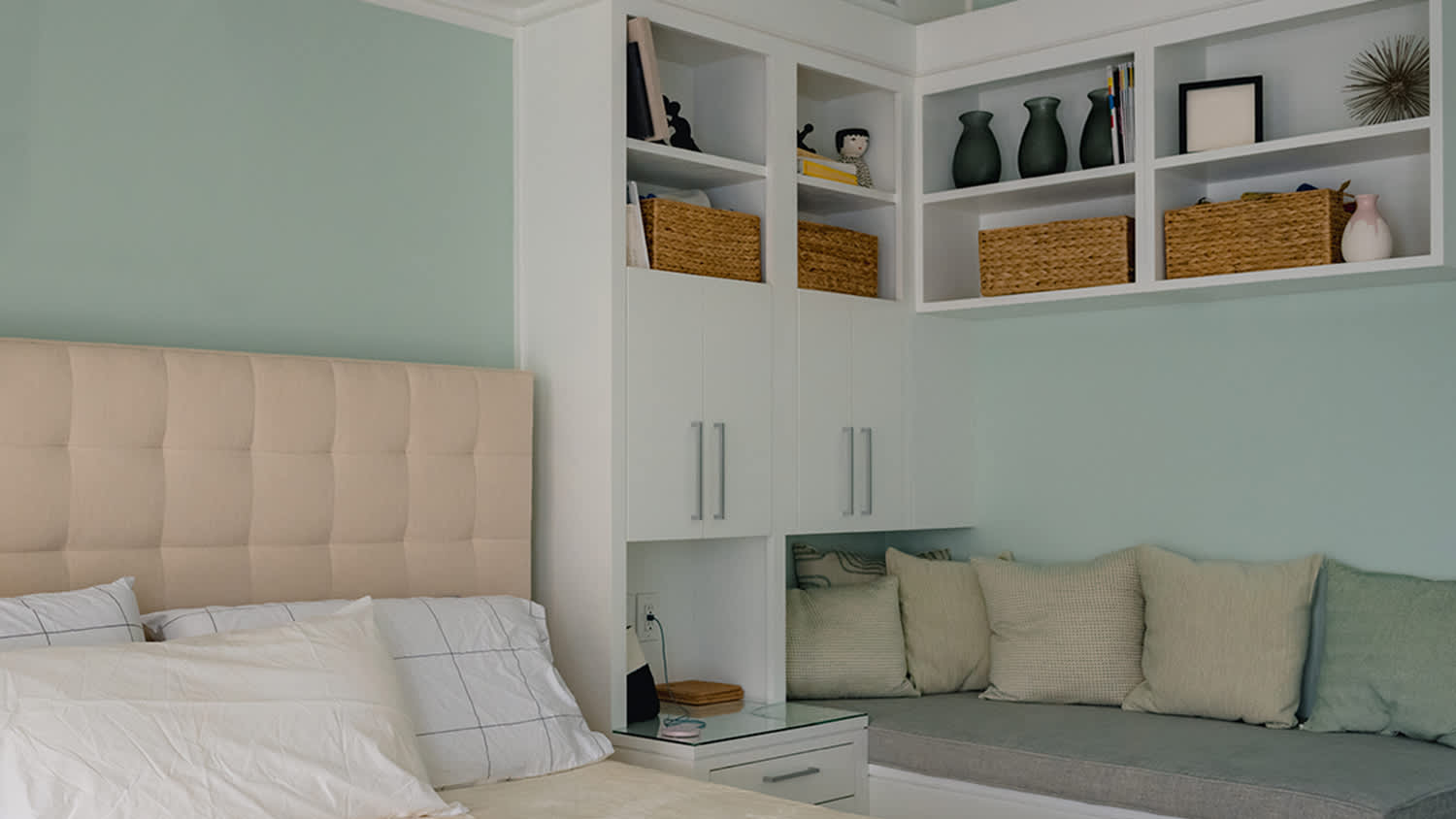 mint green bedroom with corner shelves