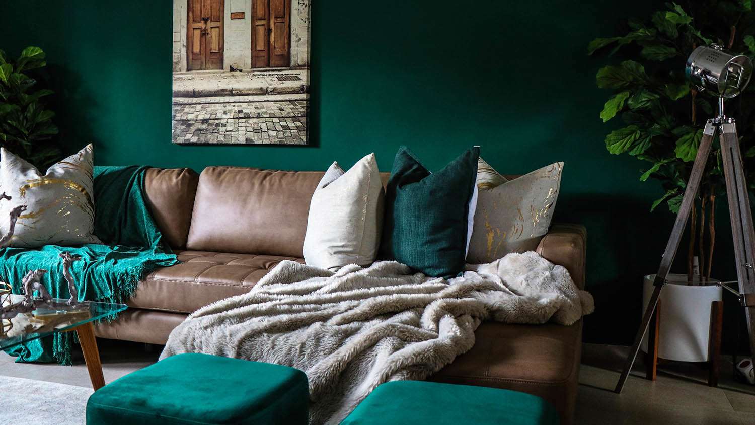 couch in living room with dark painted wall