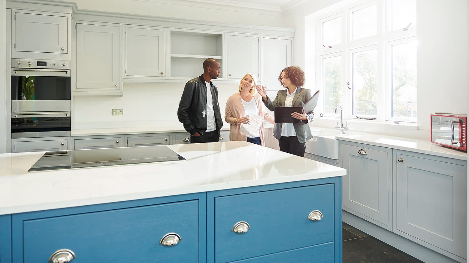 Agent showing kitchen in house