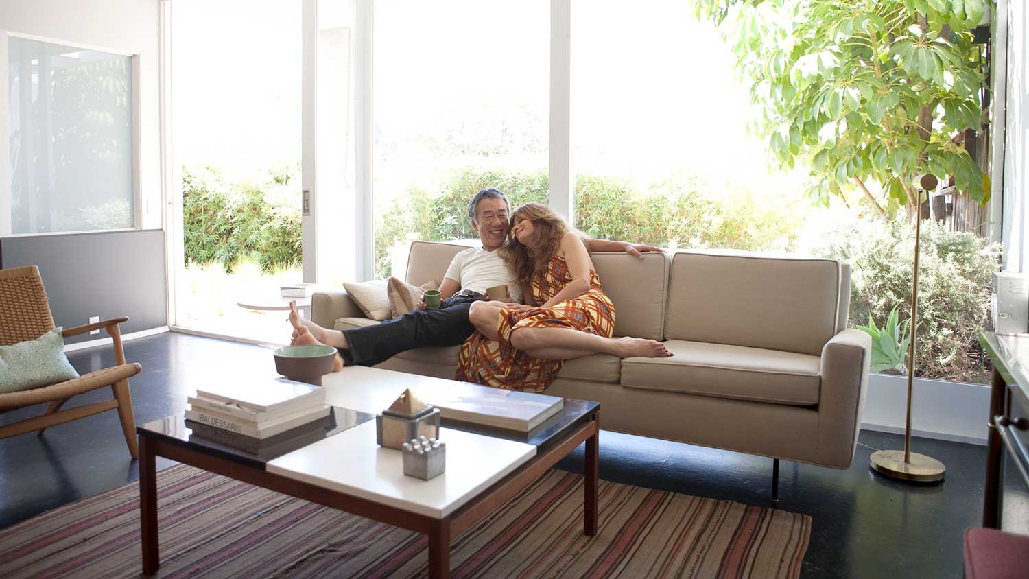 Mature couple relaxing in a modern living room