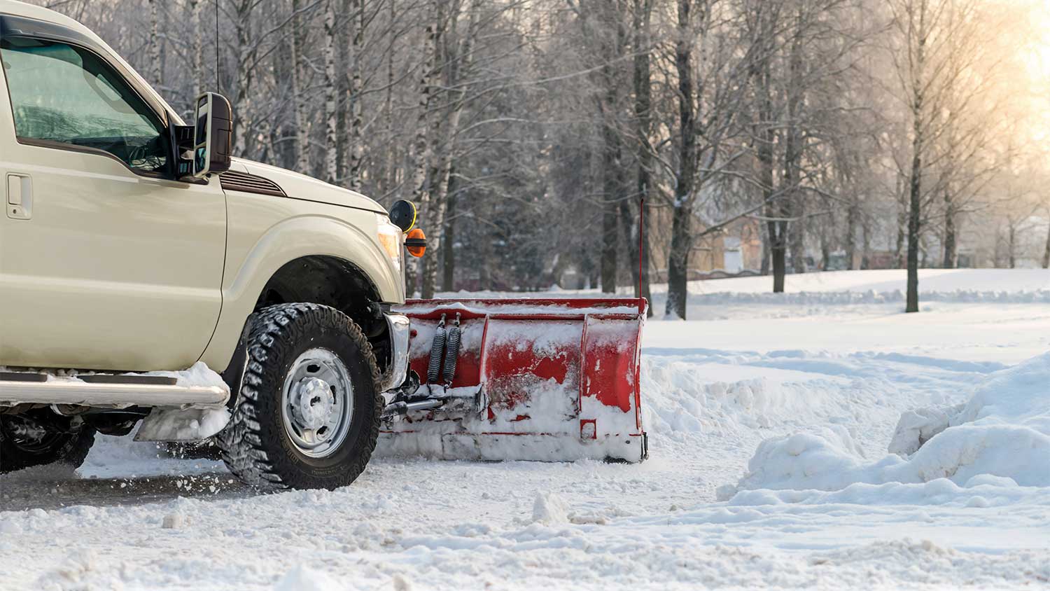Snow plow on pickup truck