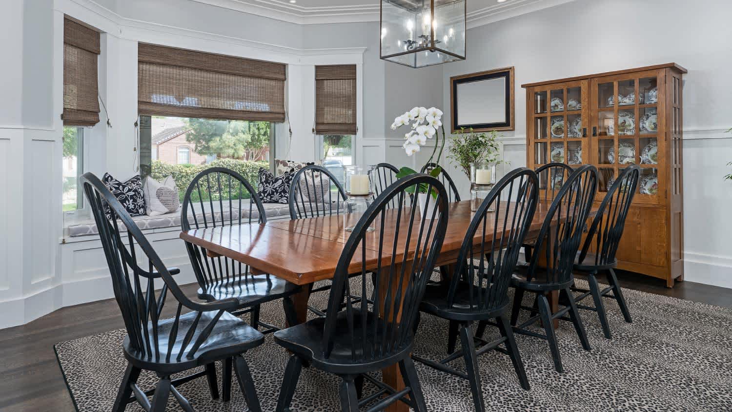A dining area with bow back chairs