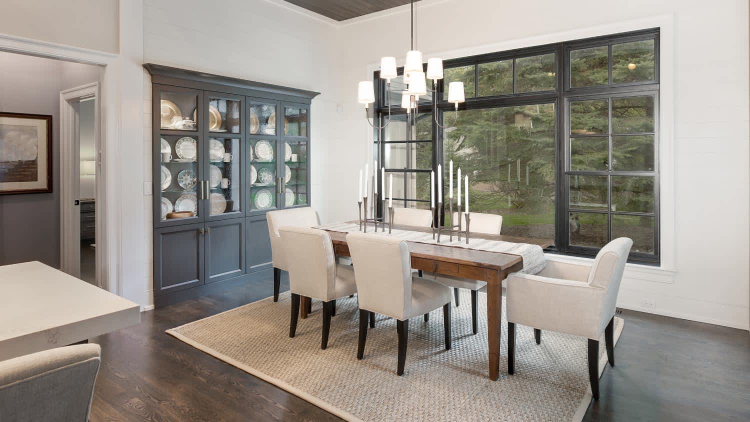 A luxury dining area with parsons chairs