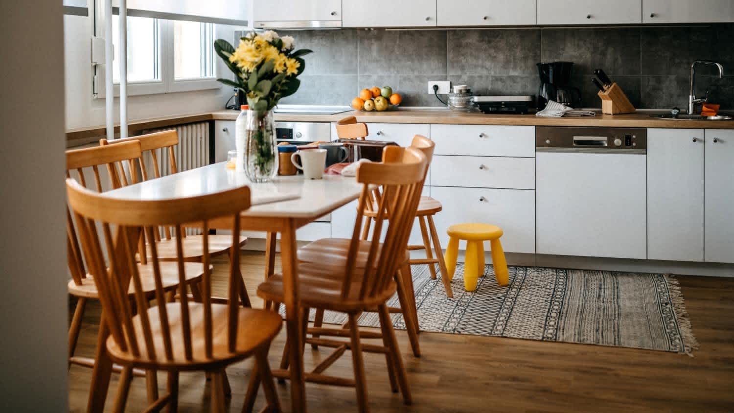 A dining area with slat back chairs
