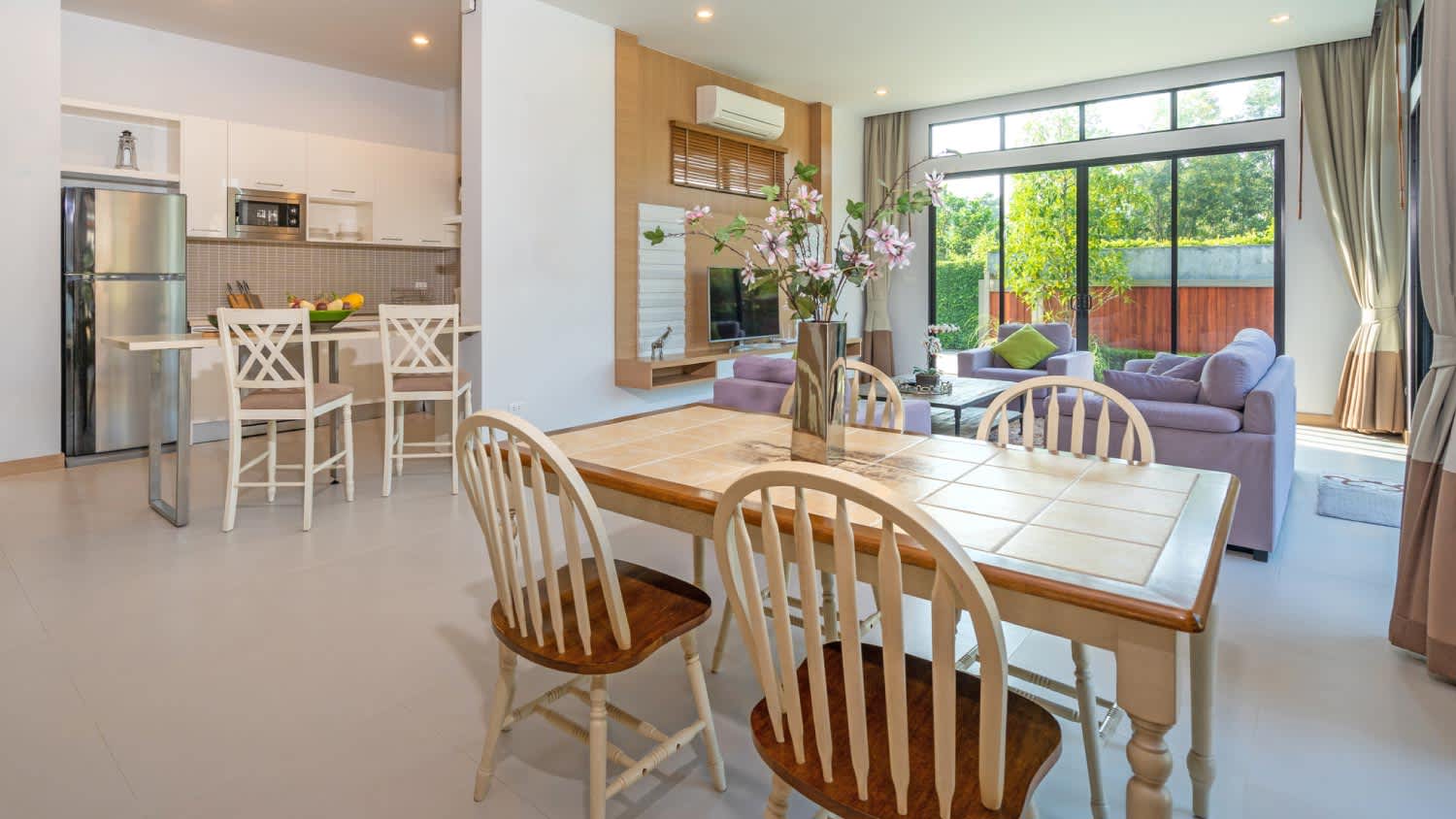 A dining area with windsor chairs