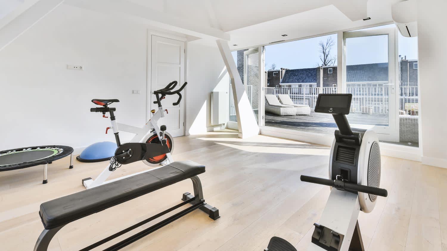 Interior of lighthouse room furnished with gym equipment