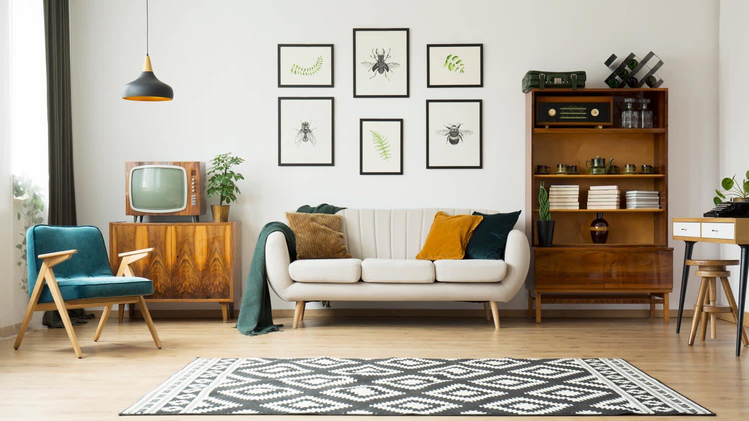 A living room with a vintage TV and retro furniture