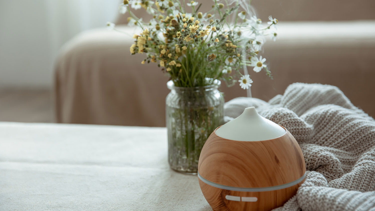 An oil diffuser on a coffee table