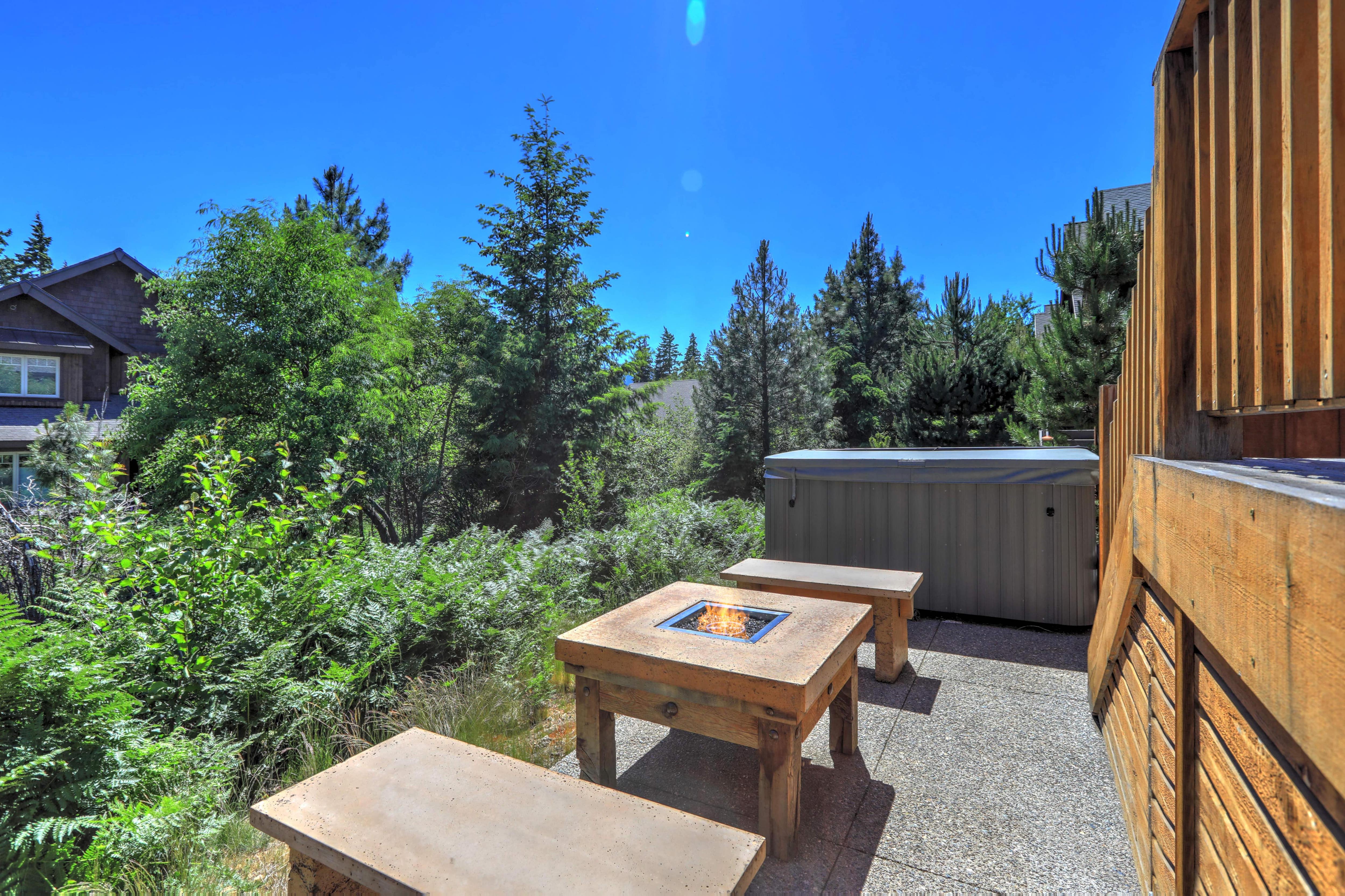 Hot tub overlooking backyard scenery