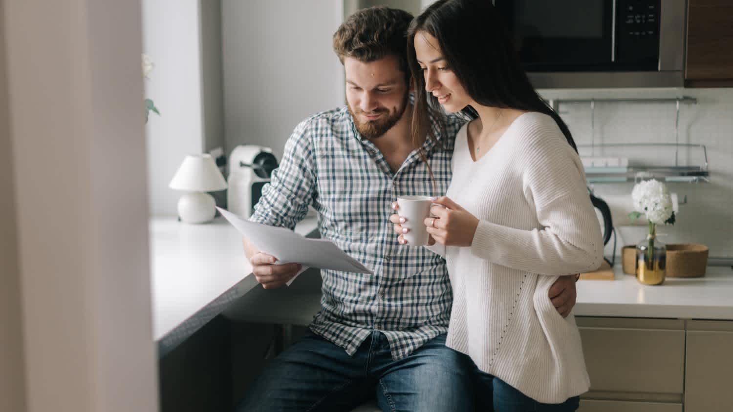 A married couple checking mortgage documents together