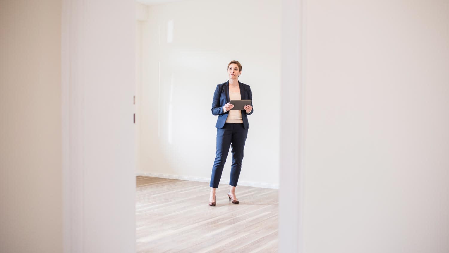 A woman in an empty apartment