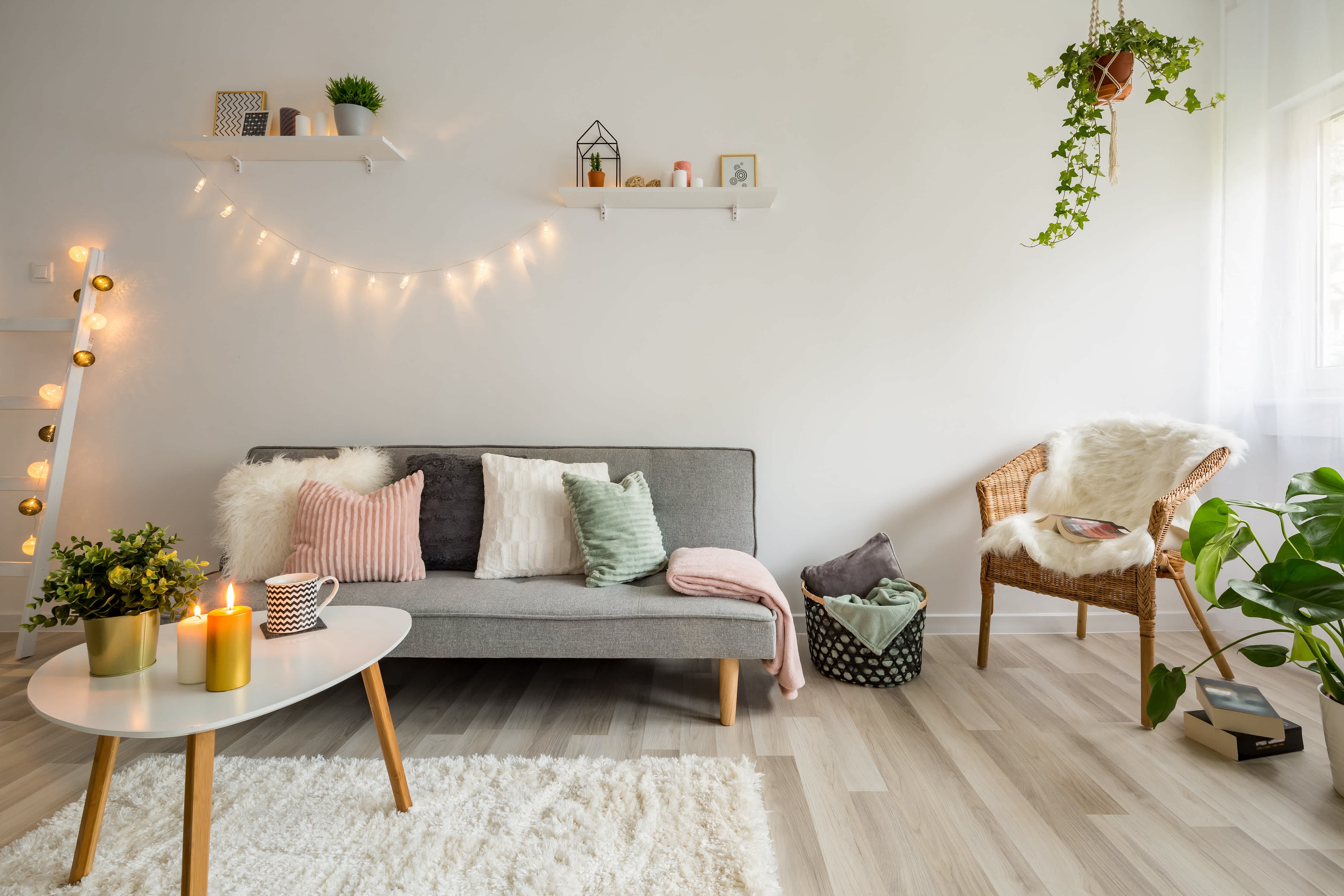 Living room with gray couch and string lights