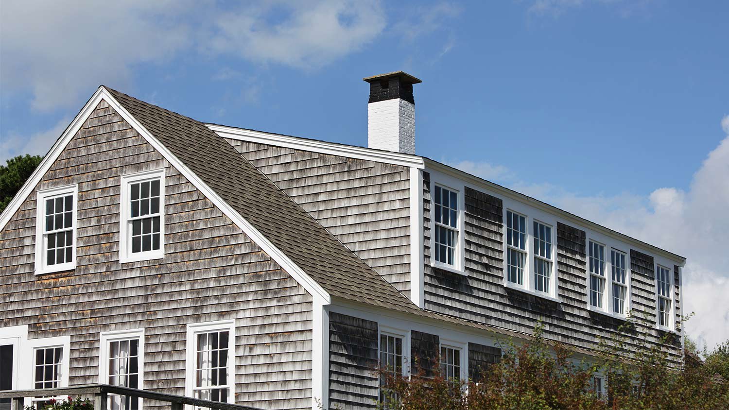 Gray siding white window frame