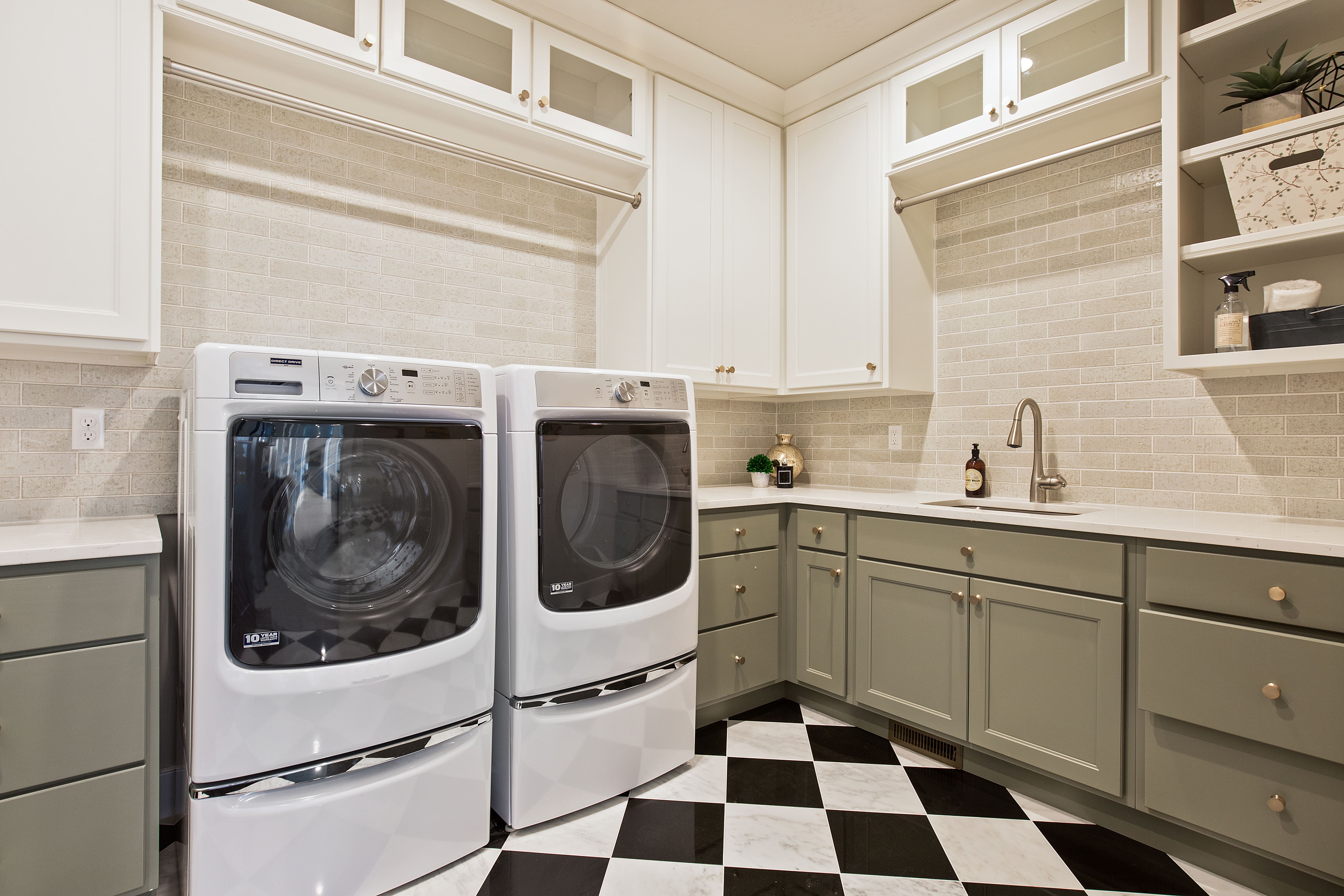 Laundry room with subway tile backsplash