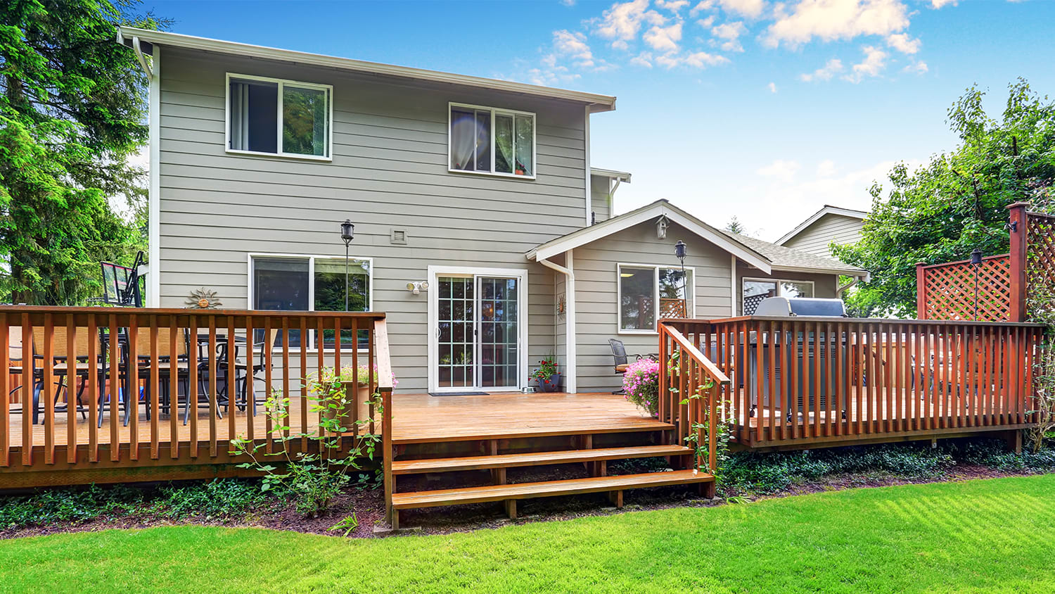 Back of house with wooden deck