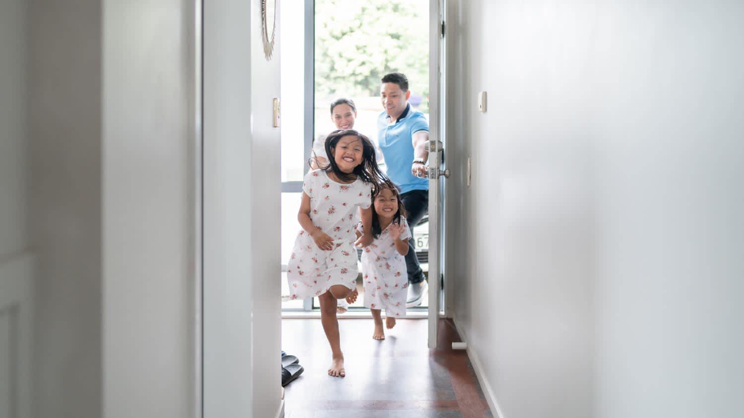 A family going through corridor of their new house