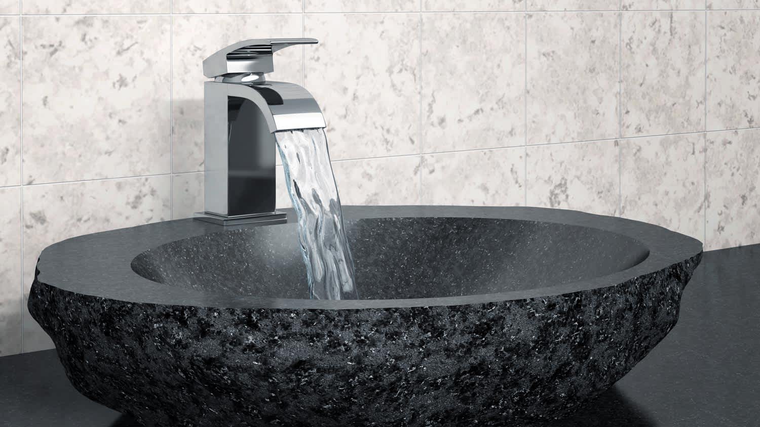 A black vessel sink running water