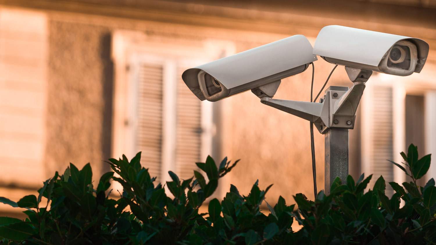 A double CCTV camera on the exterior of a house