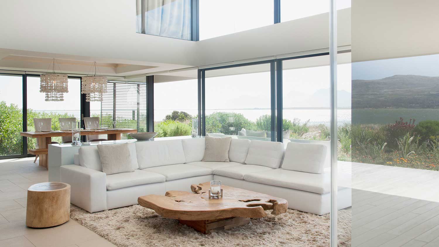 Open concept living room with tall windows