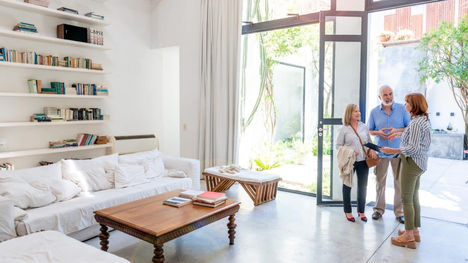 Real estate agent showing a house