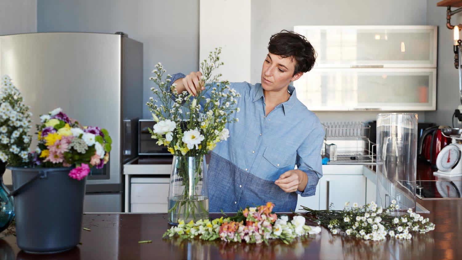 A woman taking care of her flowers