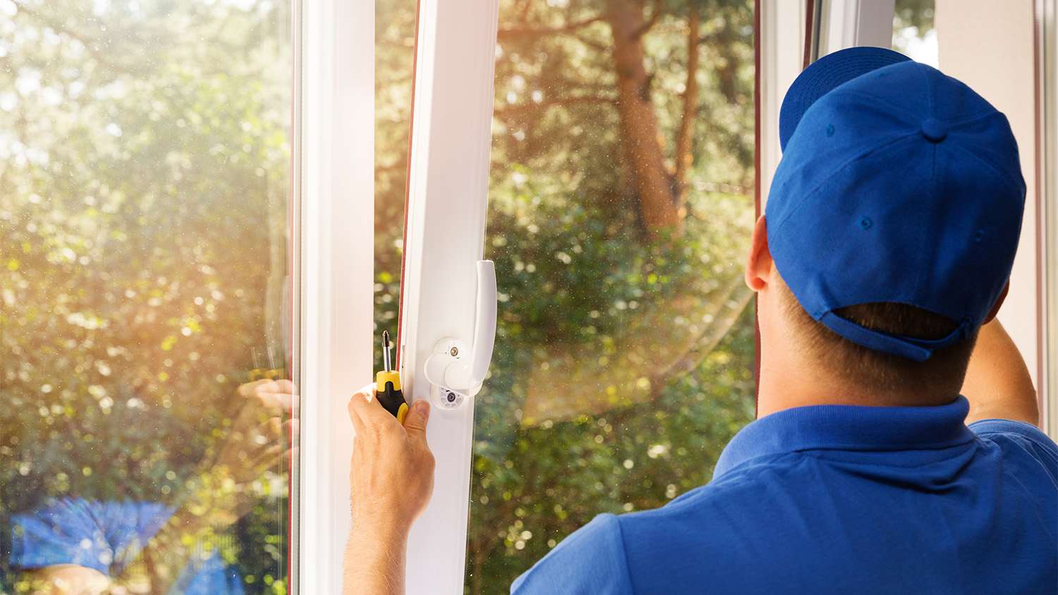 worker installing new impact windows