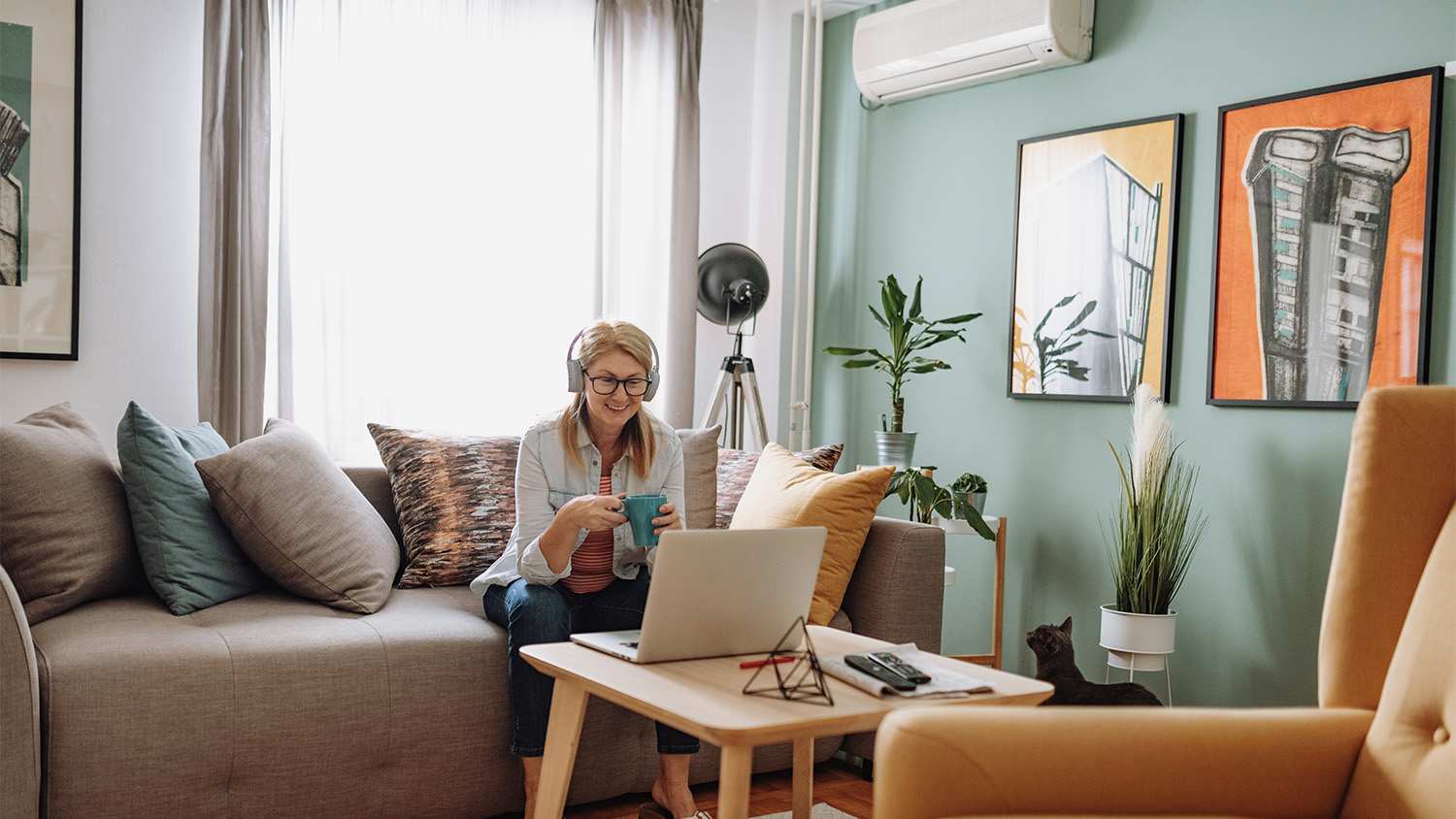 woman sitting at home while on the computer