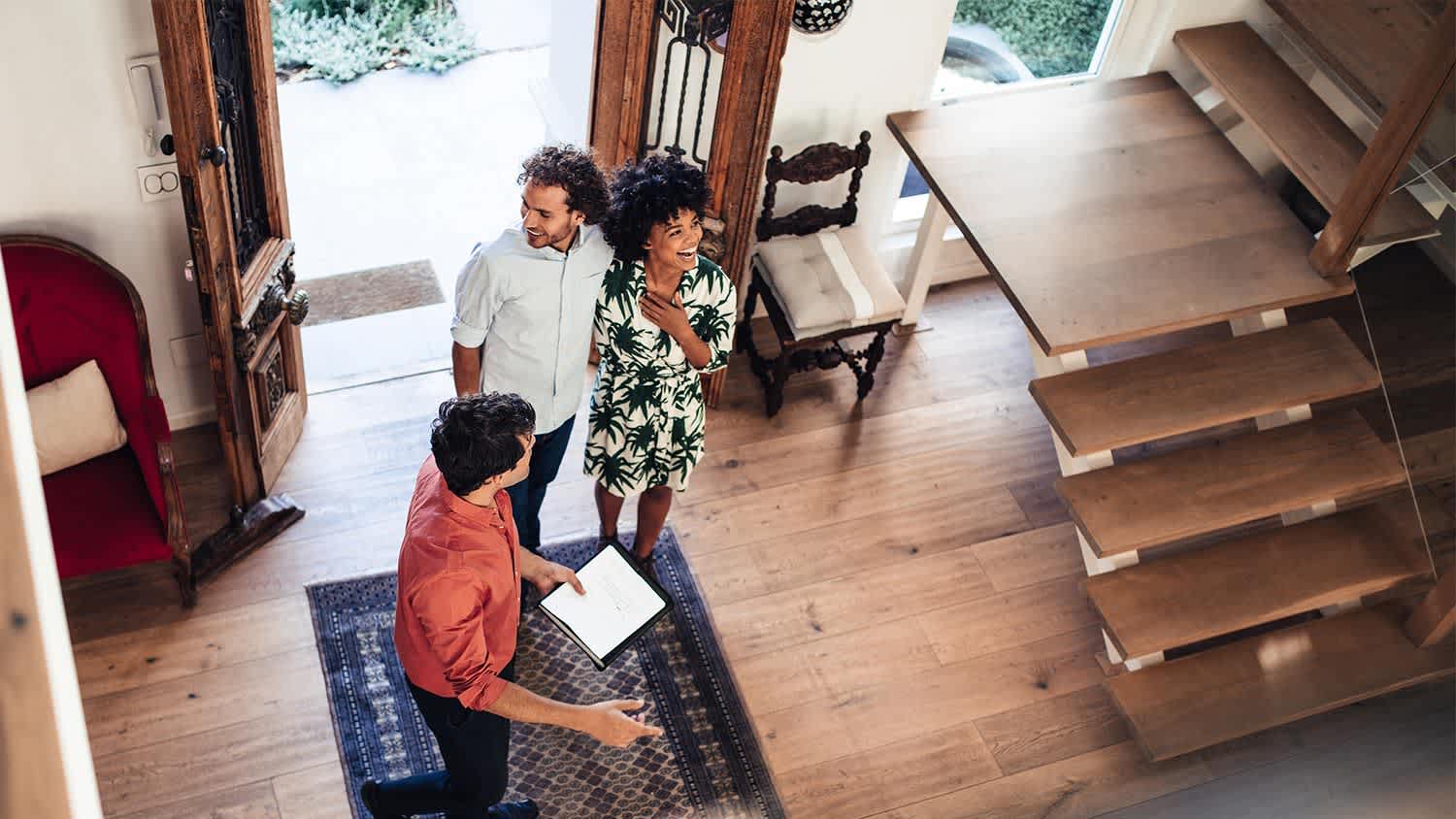 Couple enter house stairs