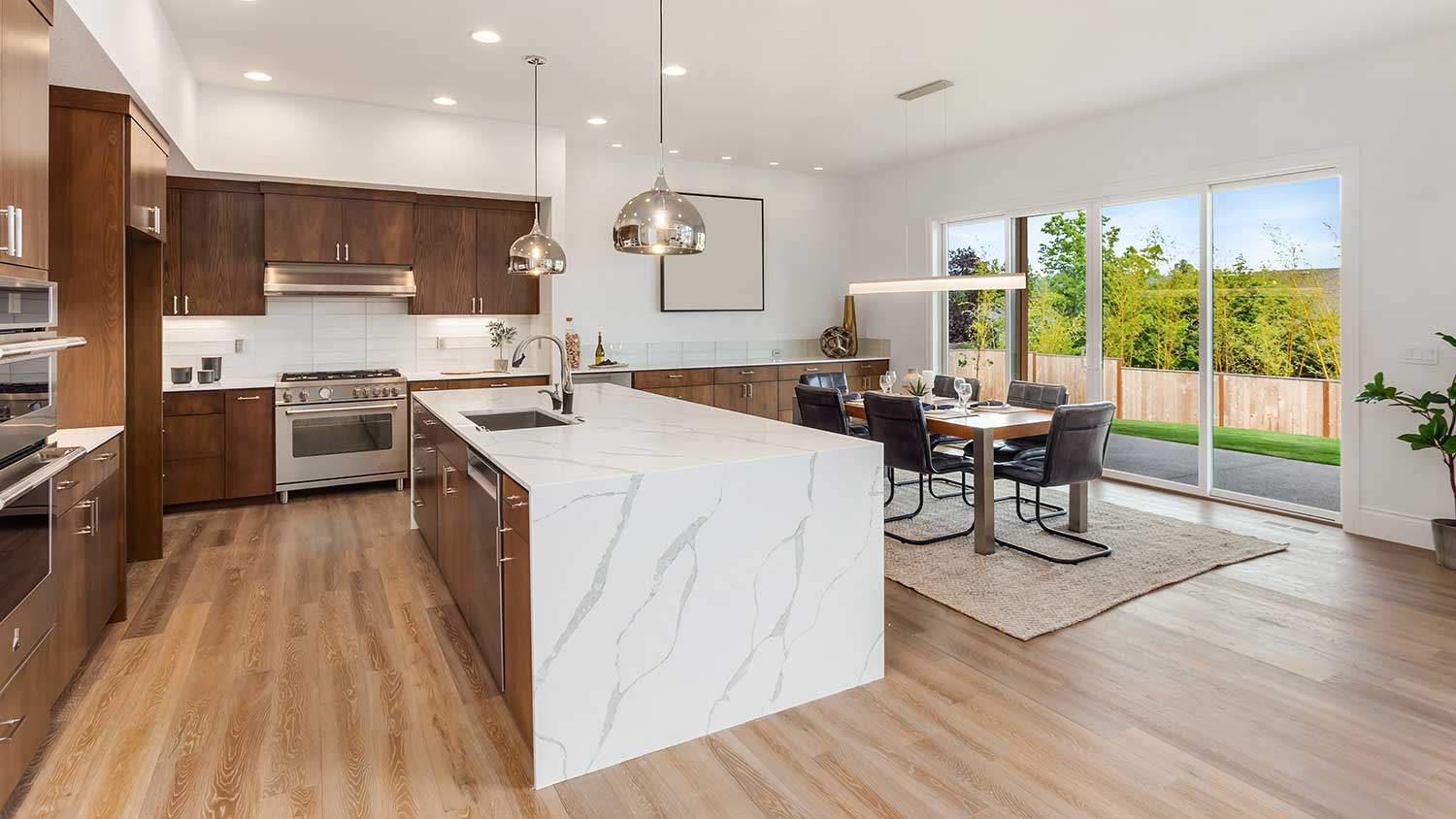 Open plan luxury kitchen with waterfall island