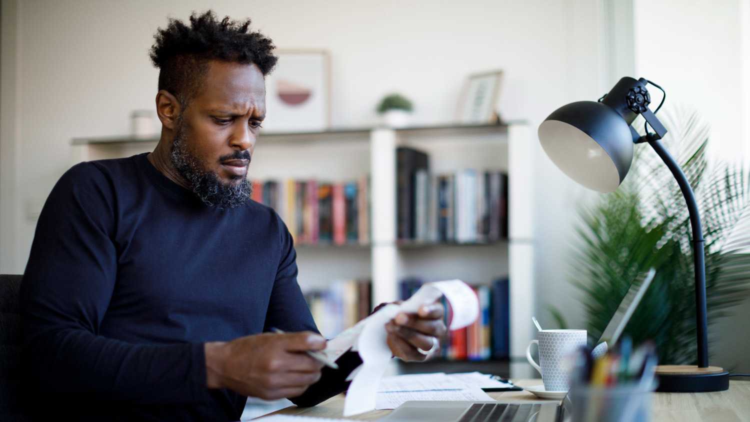 A man checking old receipts