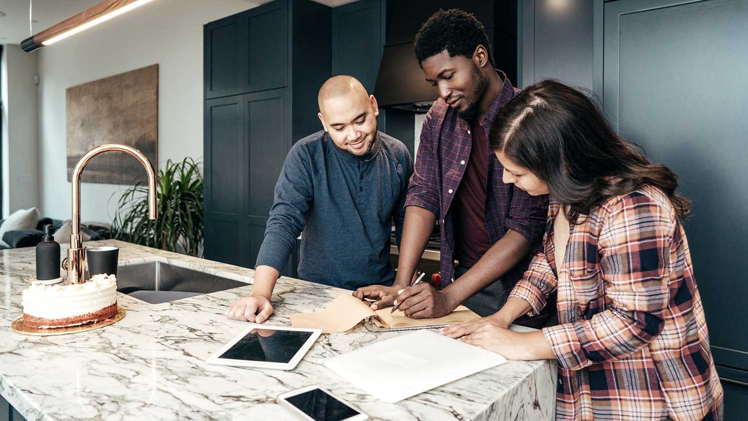 Couple reviewing contract with architect