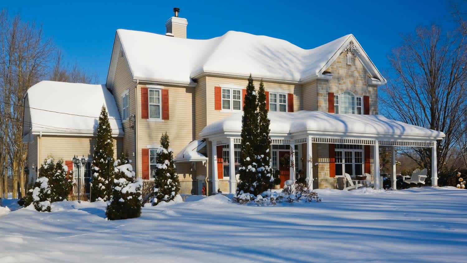 A house during winter all covered in snow