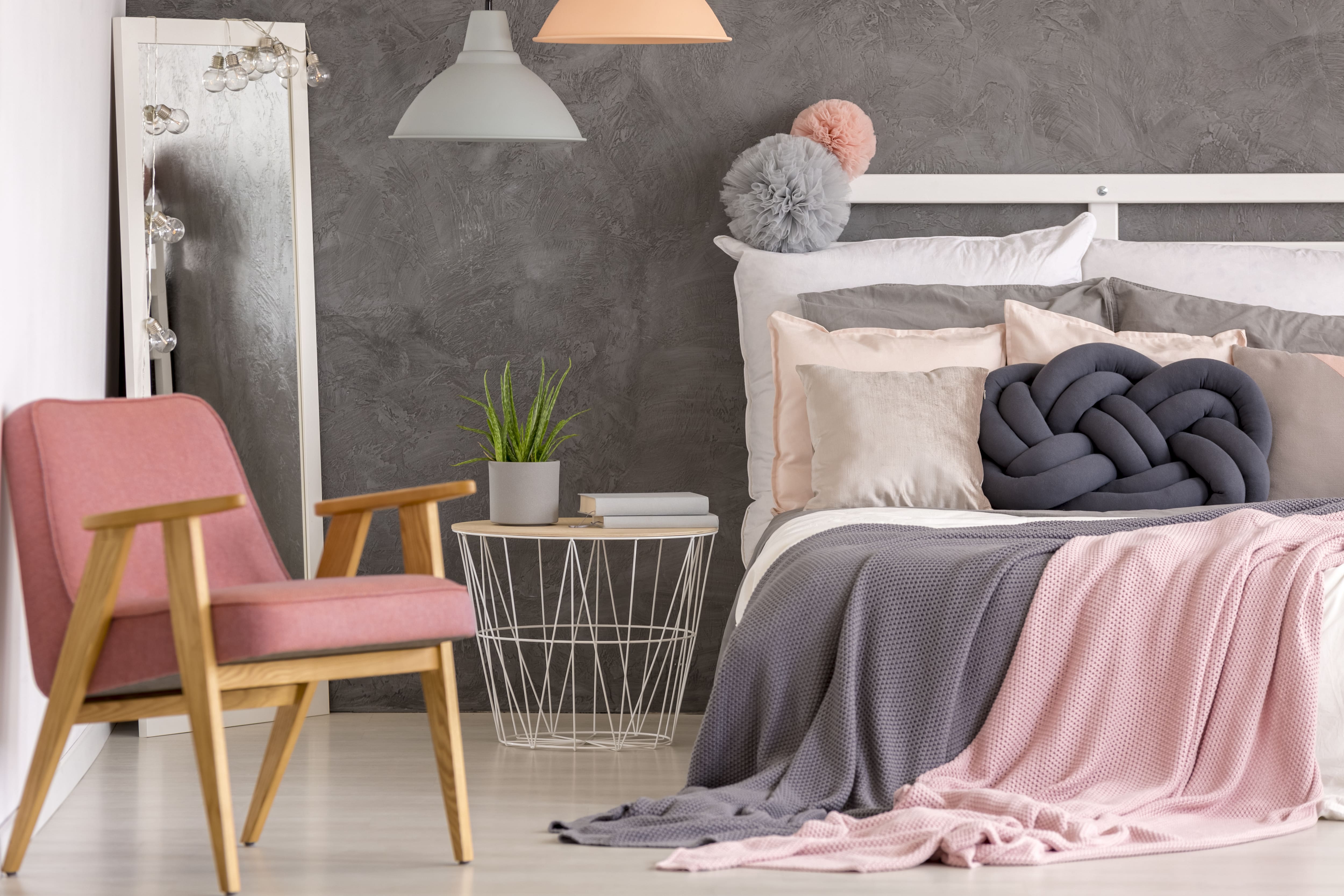 Cozy gray teen bedroom with pastel pink accents