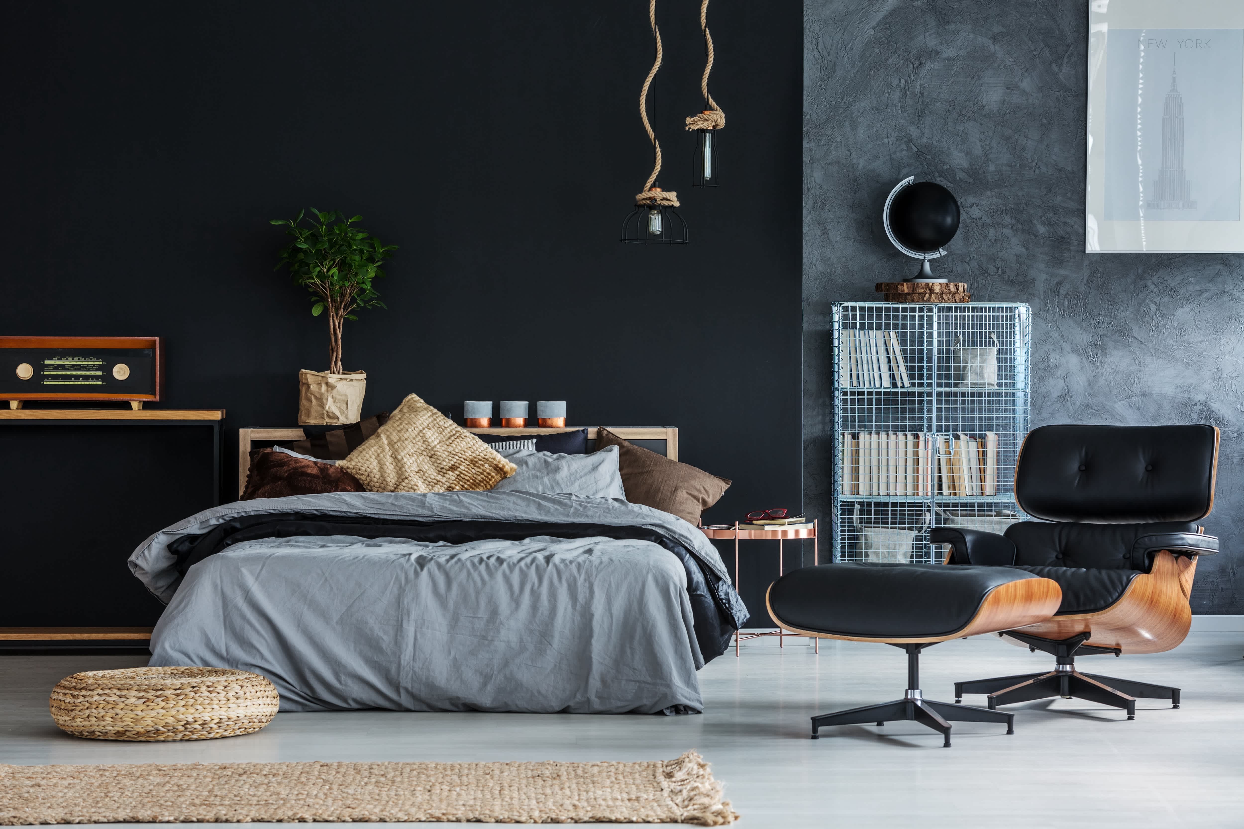 Black and gray mid century modern bedroom with rattan accessories
