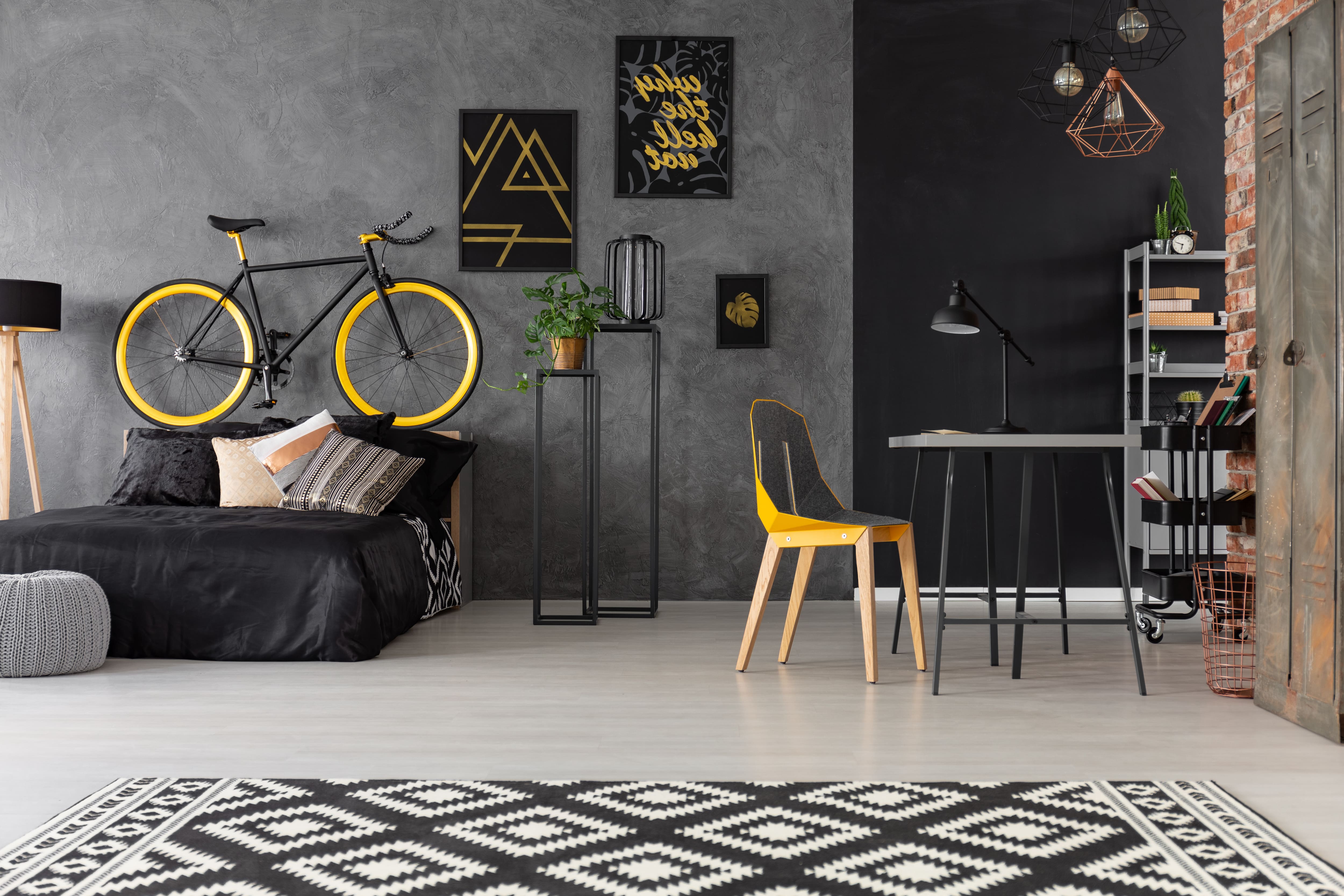 Black and gray mid century modern bedroom with rattan accessories