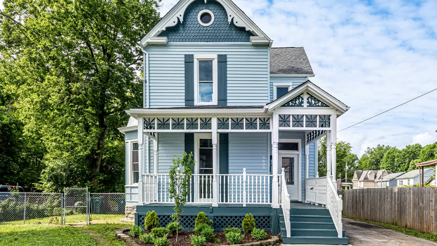 A Victorian house with different color schemes