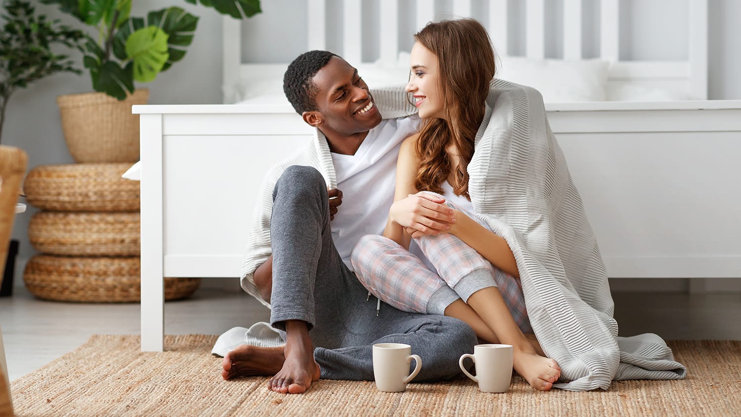 Couple keeping warm at home