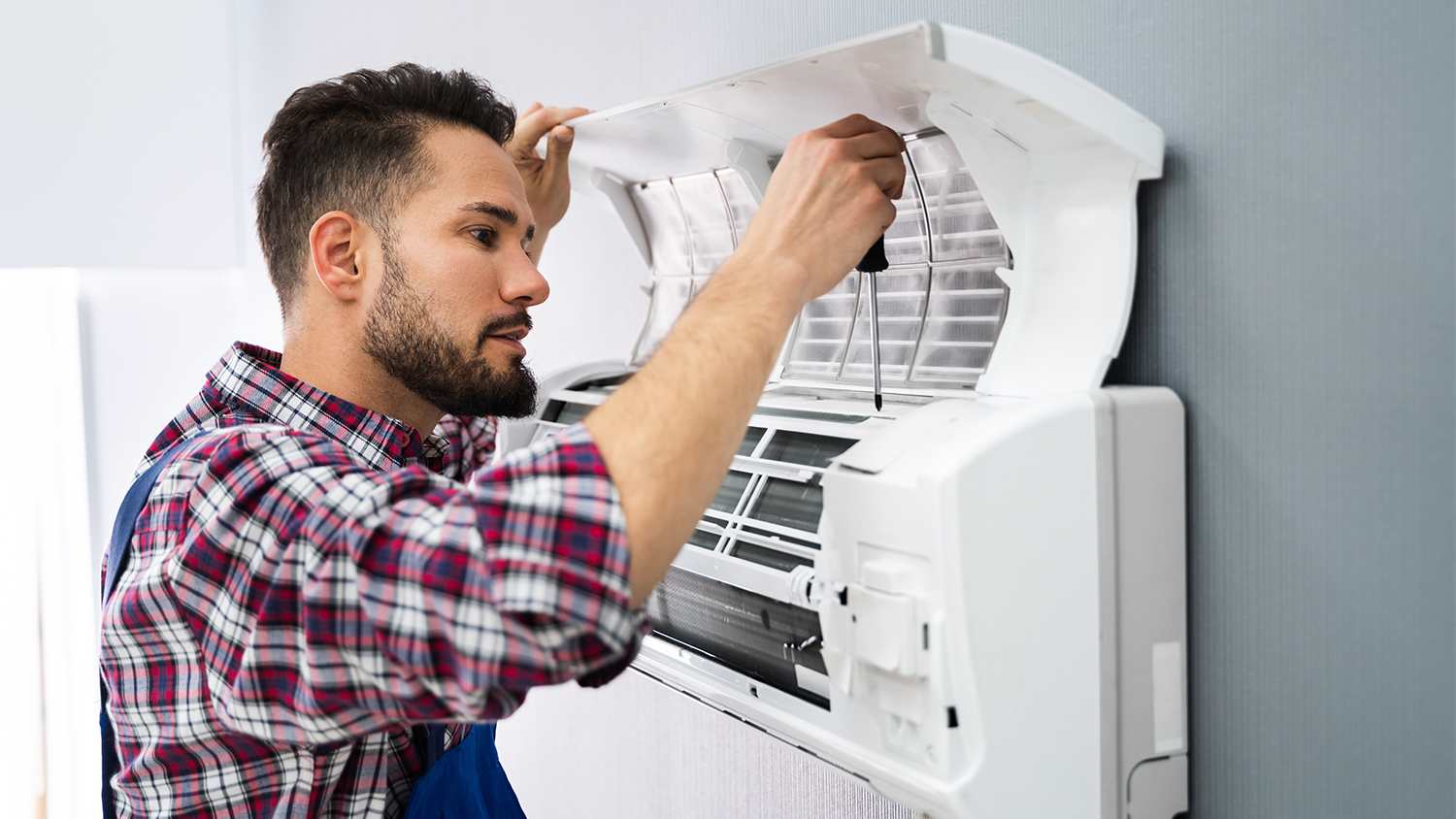 technician looking at couples AC