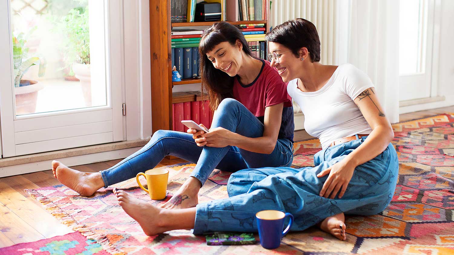 Couple sitting on the floor enjoying free time