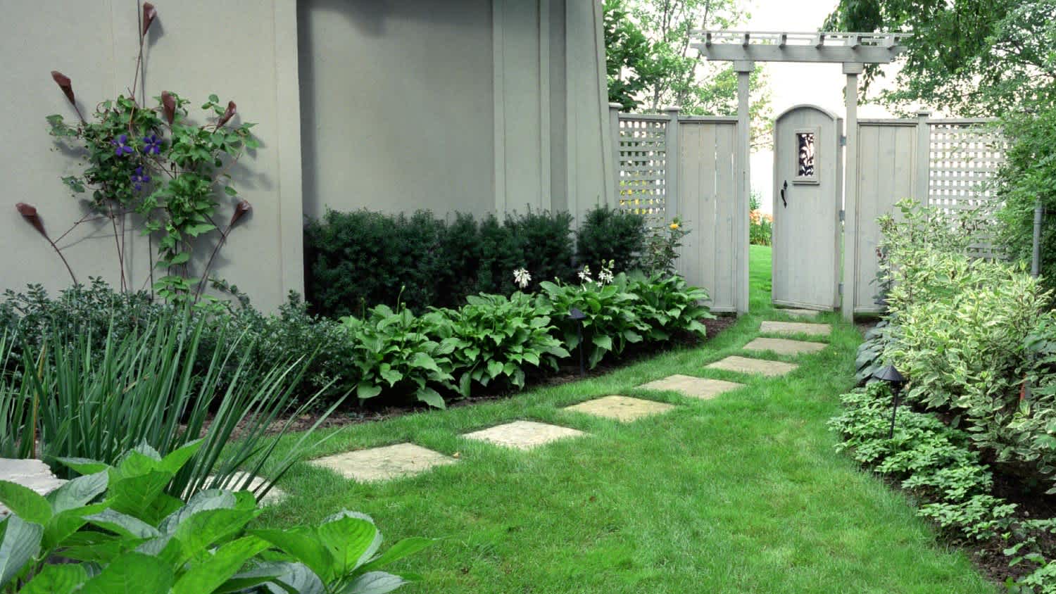 Stone path leading through a white door