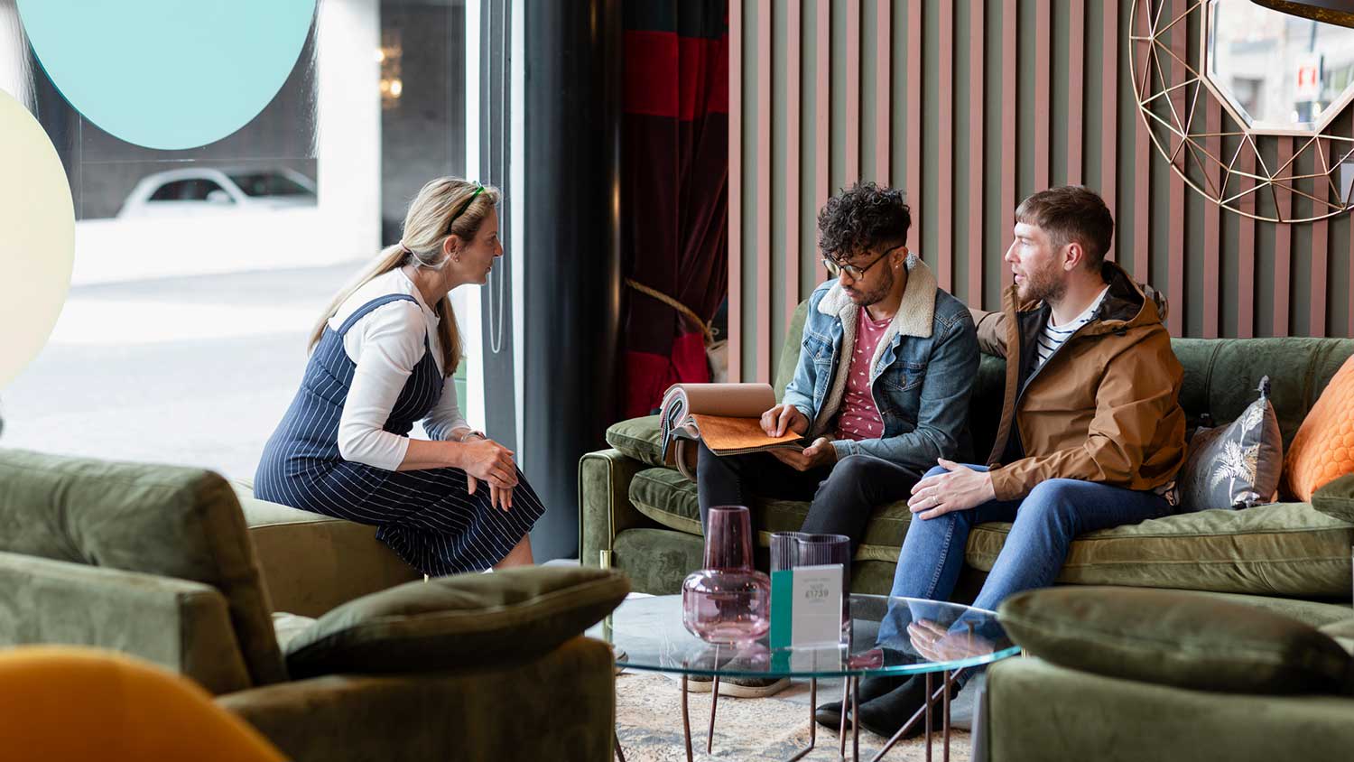 Couple sitting on a couch in a furniture store