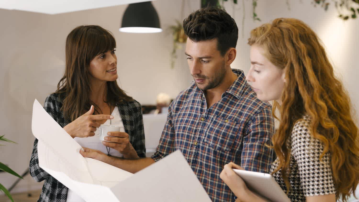 Architects reviewing blueprints