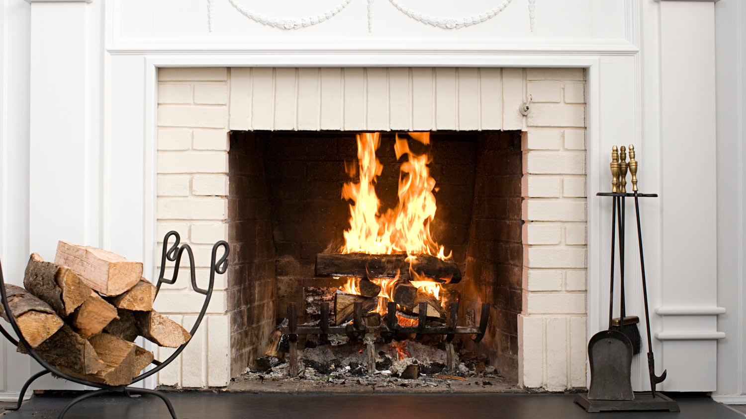Close-up of a fireplace with a decorated mantel
