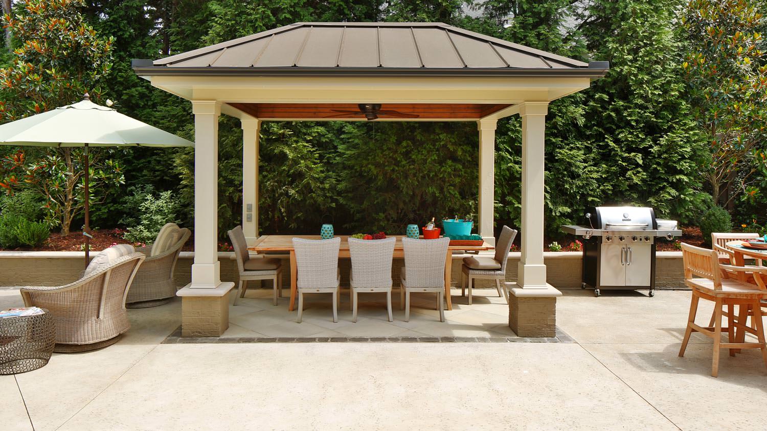A roofed paved patio
