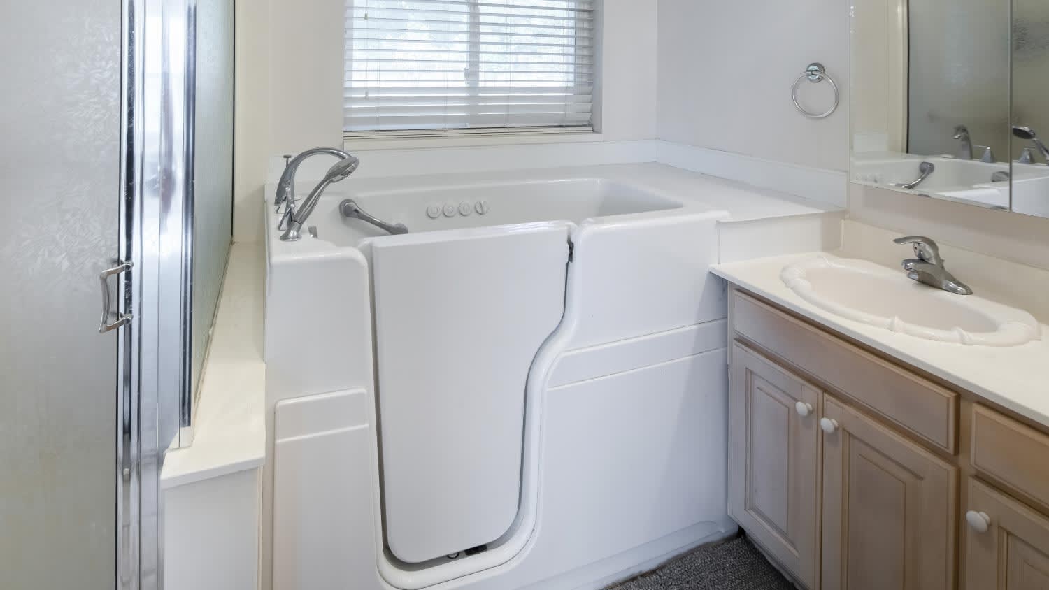 A walk-in bathtub with elderly and handicapped accessibility