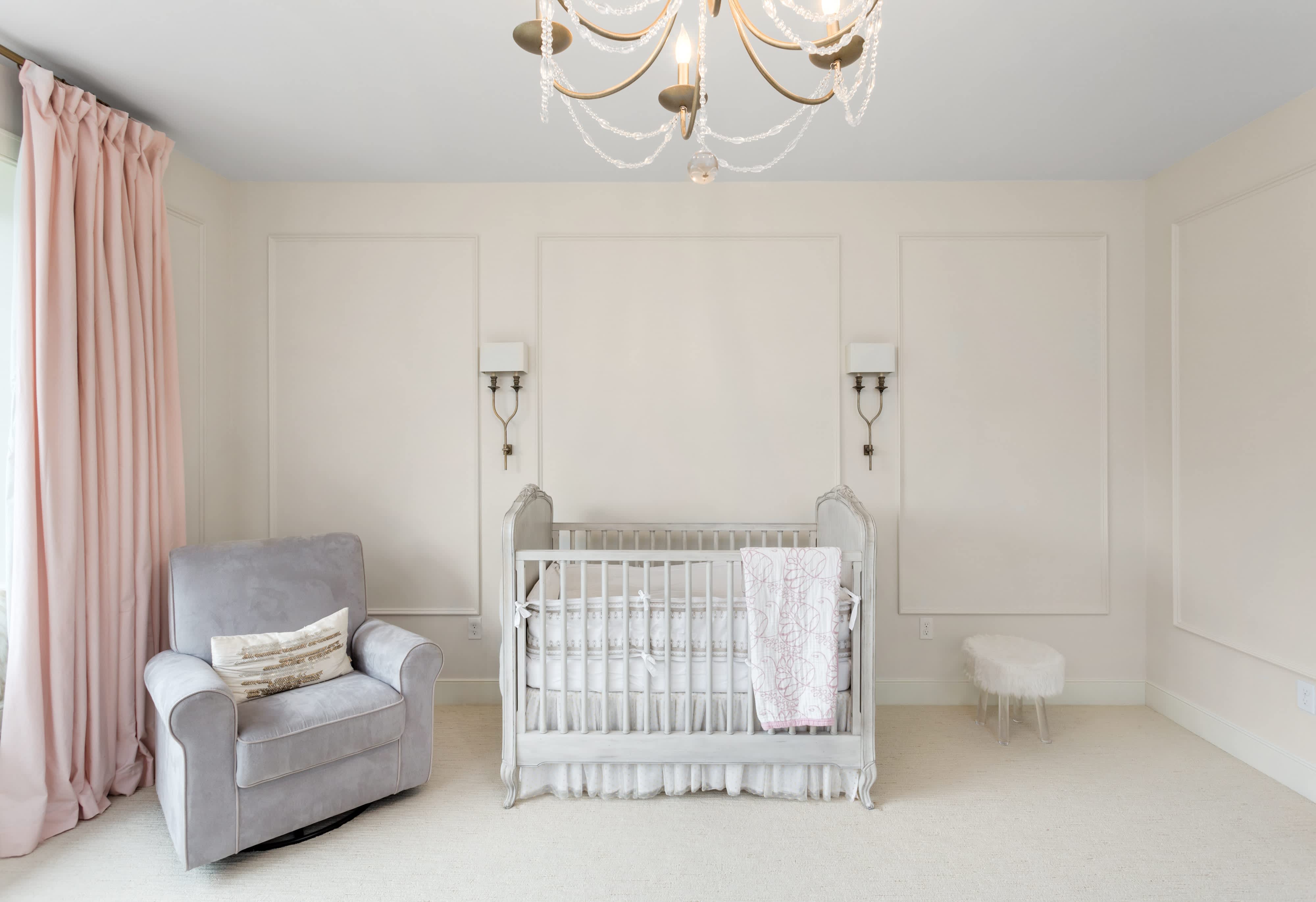 White nursery with chandelier