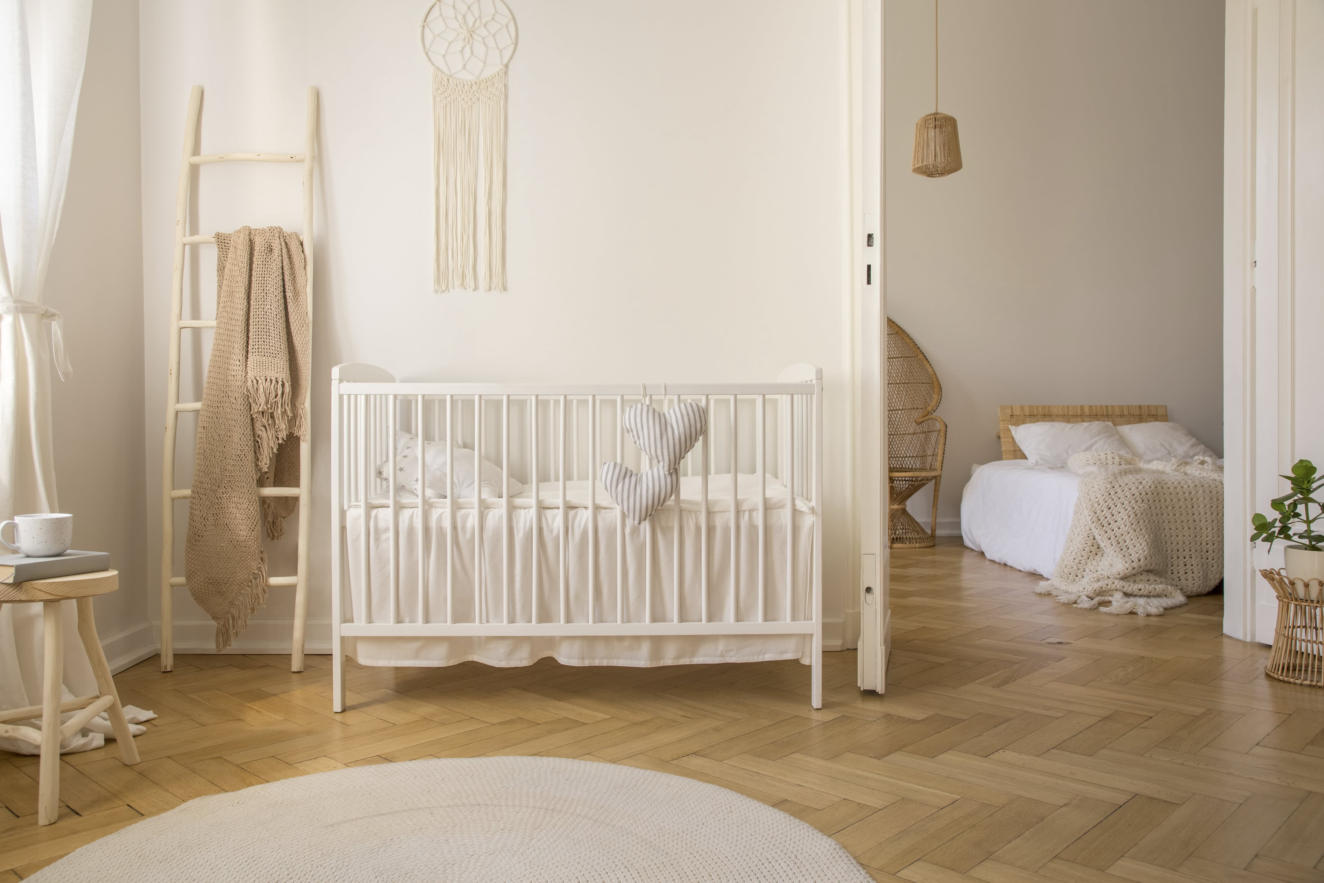White and beige nursery with wood accents