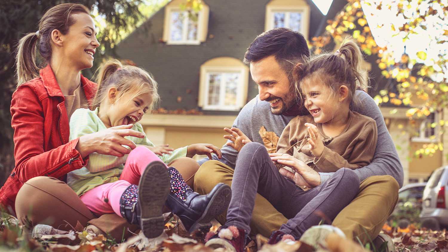 family hanging out outside of home