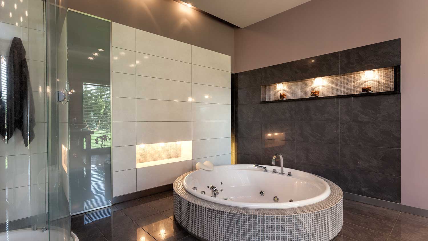 Luxury bathroom with round hot tub